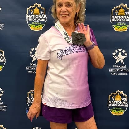 BFit505 senior athlete with medal